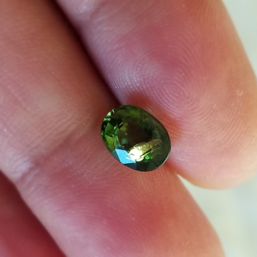 Rare Demantoid russian garnet with horse tail inclusion